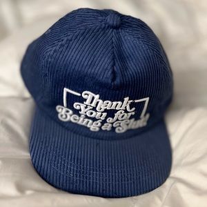 Assholes Live Forever. White on Blue Corduroy SnapBack Hat.